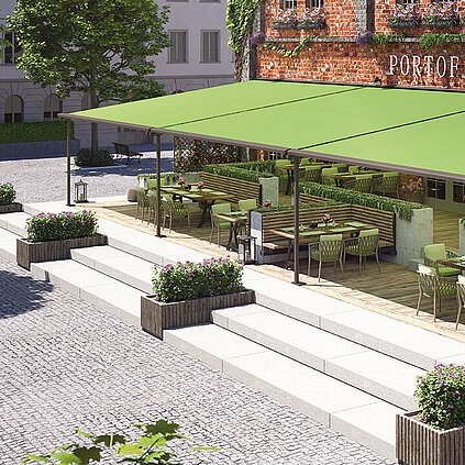 Gekoppelte grüne Pergolamarkisen bei Dämmerung an einer Gastronomie mit Klinkersteinen über Sitzgelegenheiten 